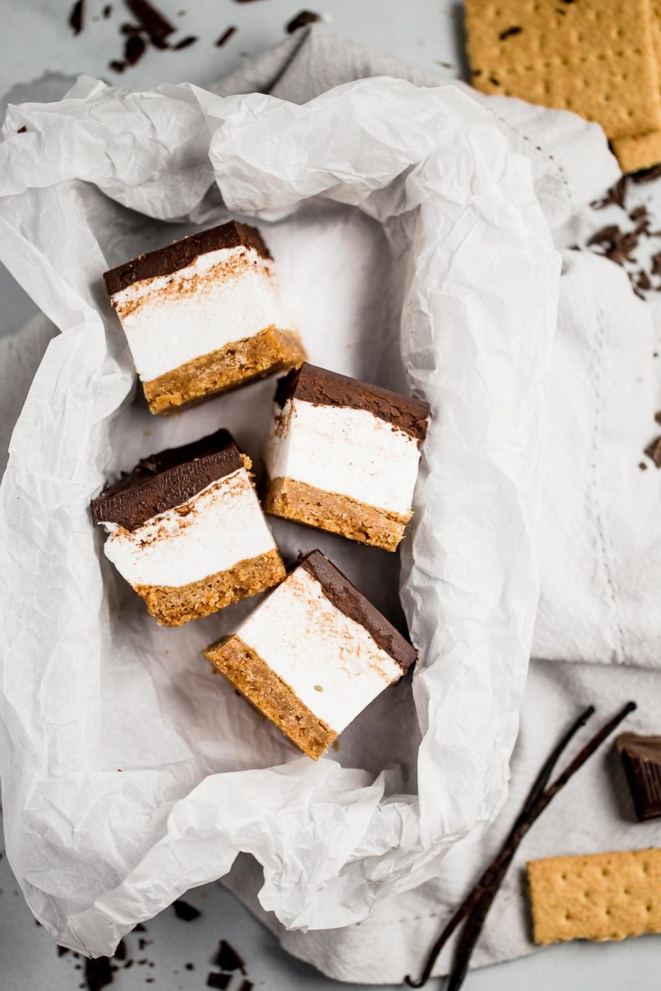 everyone’s childhood summer favorite gets a major update in this recipe for s’mores bars. these s’mores bars sandwich a thick layer of fluffy homemade vanilla bean marshmallow in between graham cracker crust & salted dark chocolate ganache. your favorite campfire treat will never be the same!